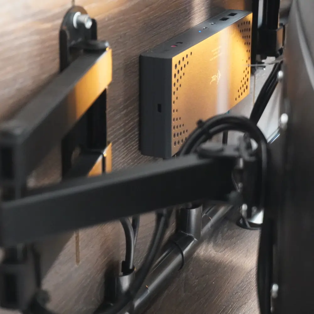 Close-up of cable management system inside an open DropTop desk.