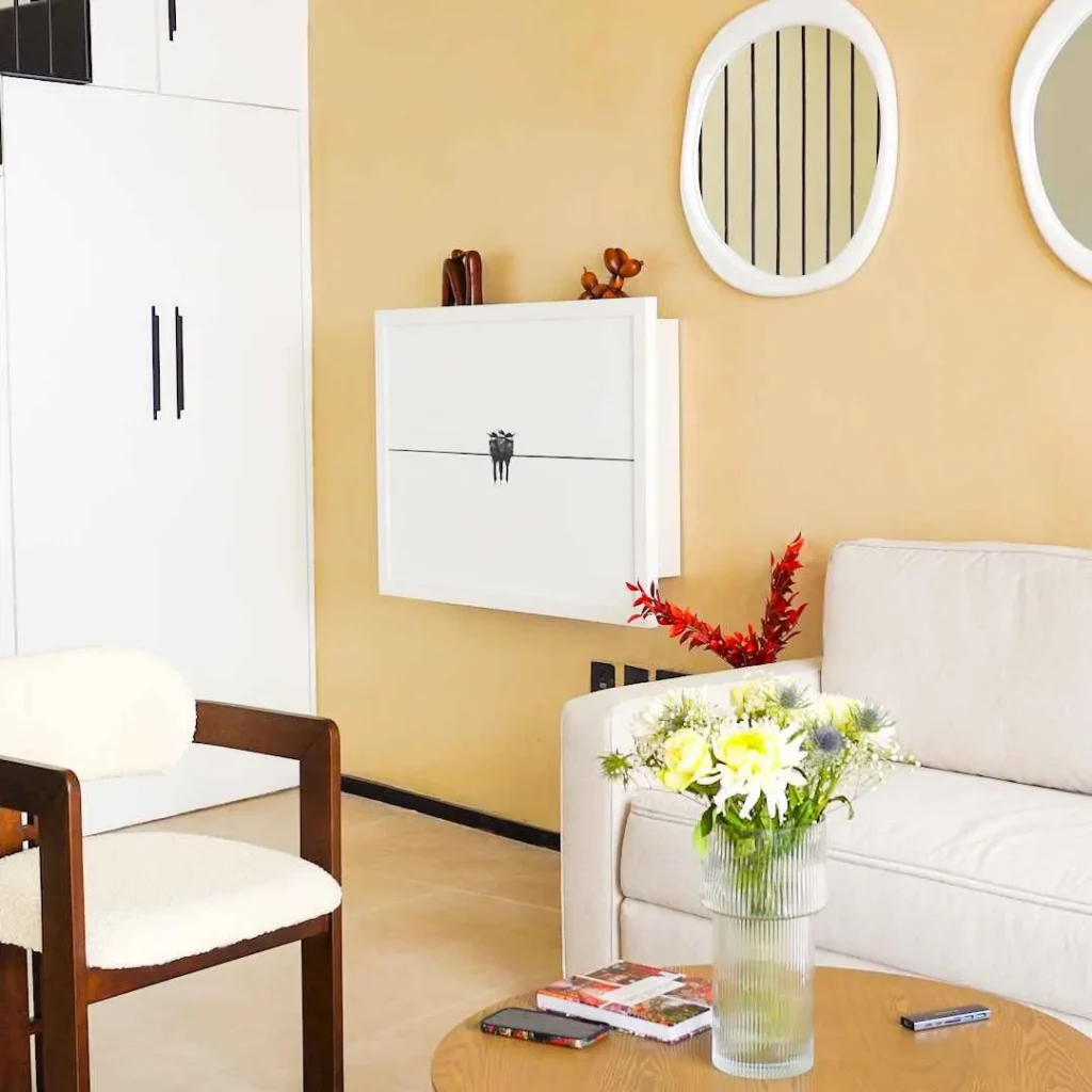 Minimalist living space featuring a concealed home office