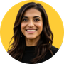 Woman with long dark hair against yellow background