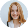 Smiling woman portrait used as a customer icon.