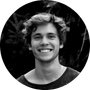 Black and white portrait of a smiling man used as a customer icon.