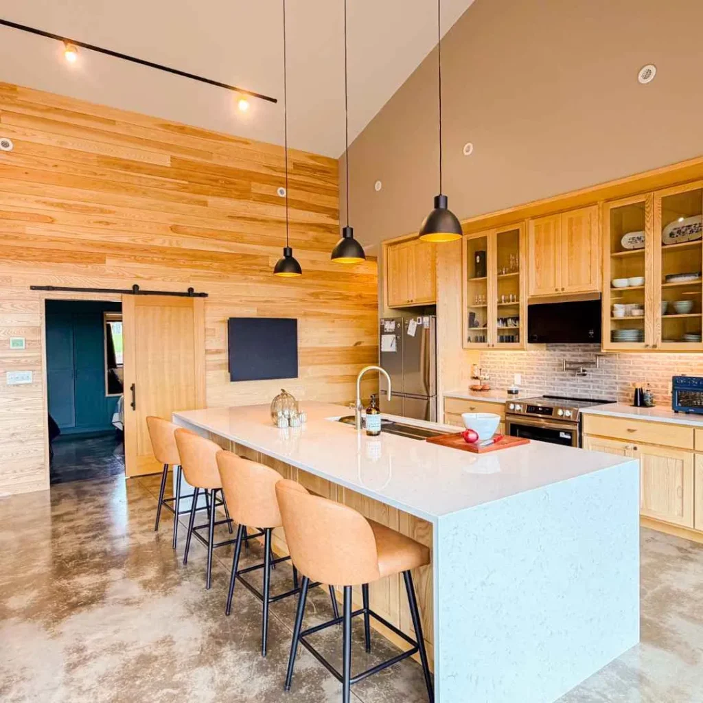 Closed wall mounted desk blending seamlessly into a modern open plan kitchen