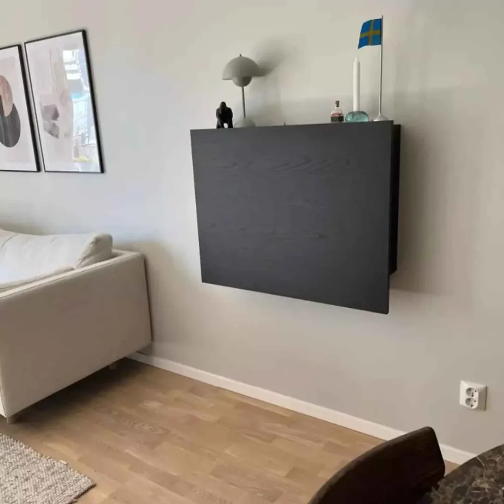 Hidden workspace solution with fold away desk integrated into a clean contemporary interior