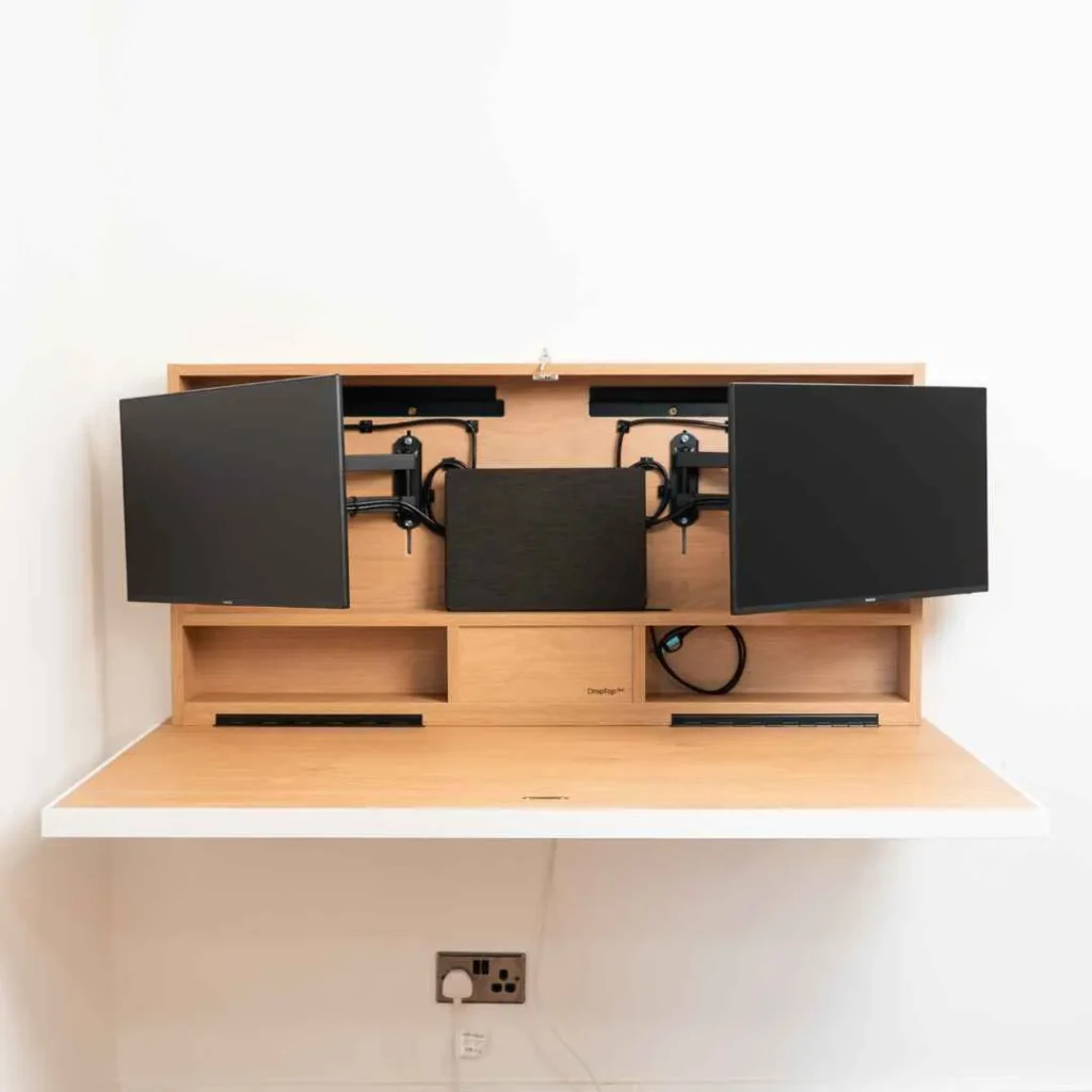 Floating wall desk with multi monitor configuration and internal storage for modern remote work