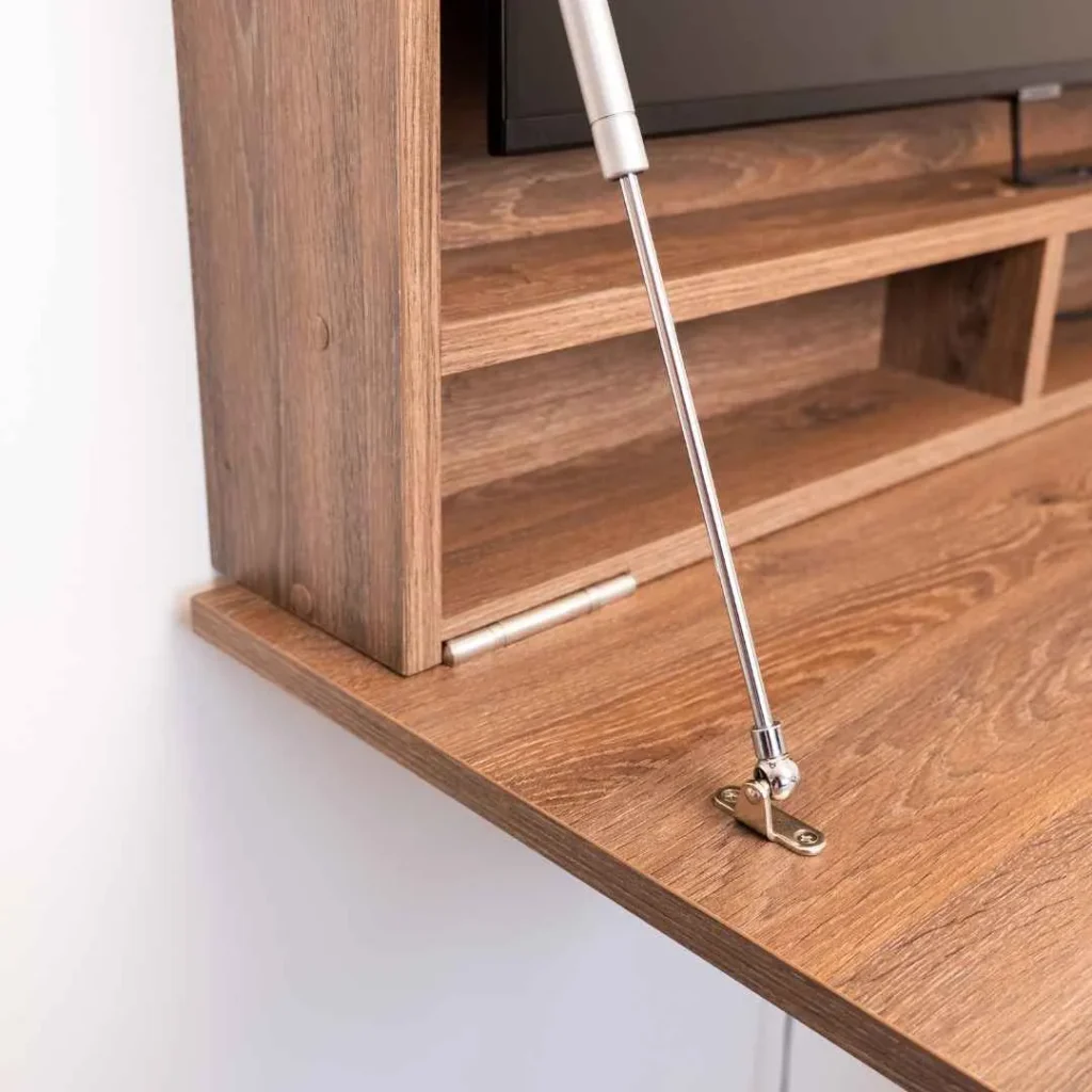 Soft close stays supporting a drop down desk for smooth opening and stability