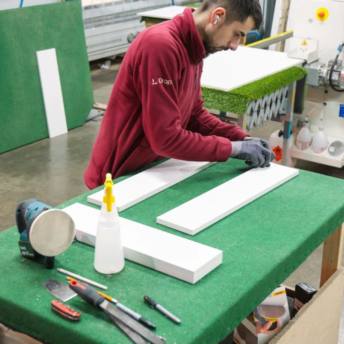 Wall-Mounted Folding Desks for Home Offices DropTop folding desk components being assembled in workshop highlighting craftsmanship and space saving design.