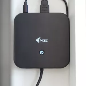 Compact connectivity dock mounted vertically with cables connected.