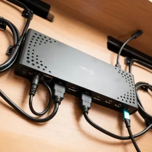 Connectivity dock mounted behind a monitor with multiple cables connected.