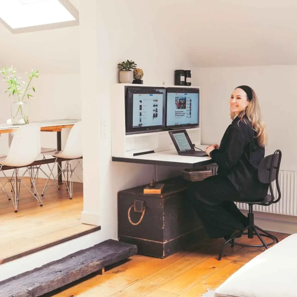 Person using a DropTop desk in a home office interior.